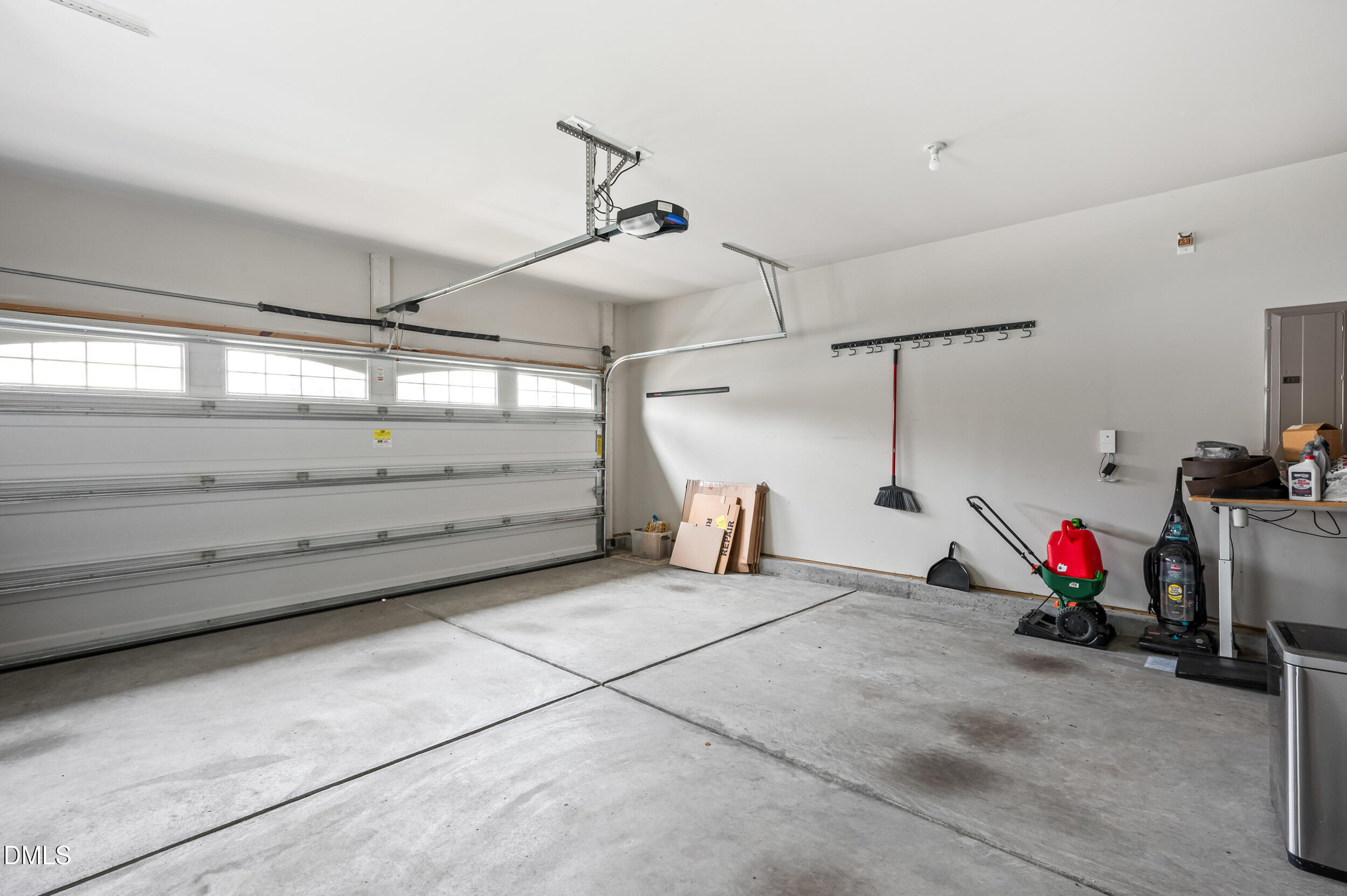 1301 Oatney Ridge Lane Morrisville, NC 27560 - Photo 22 of 38 a view of a garage with rack and bicycle