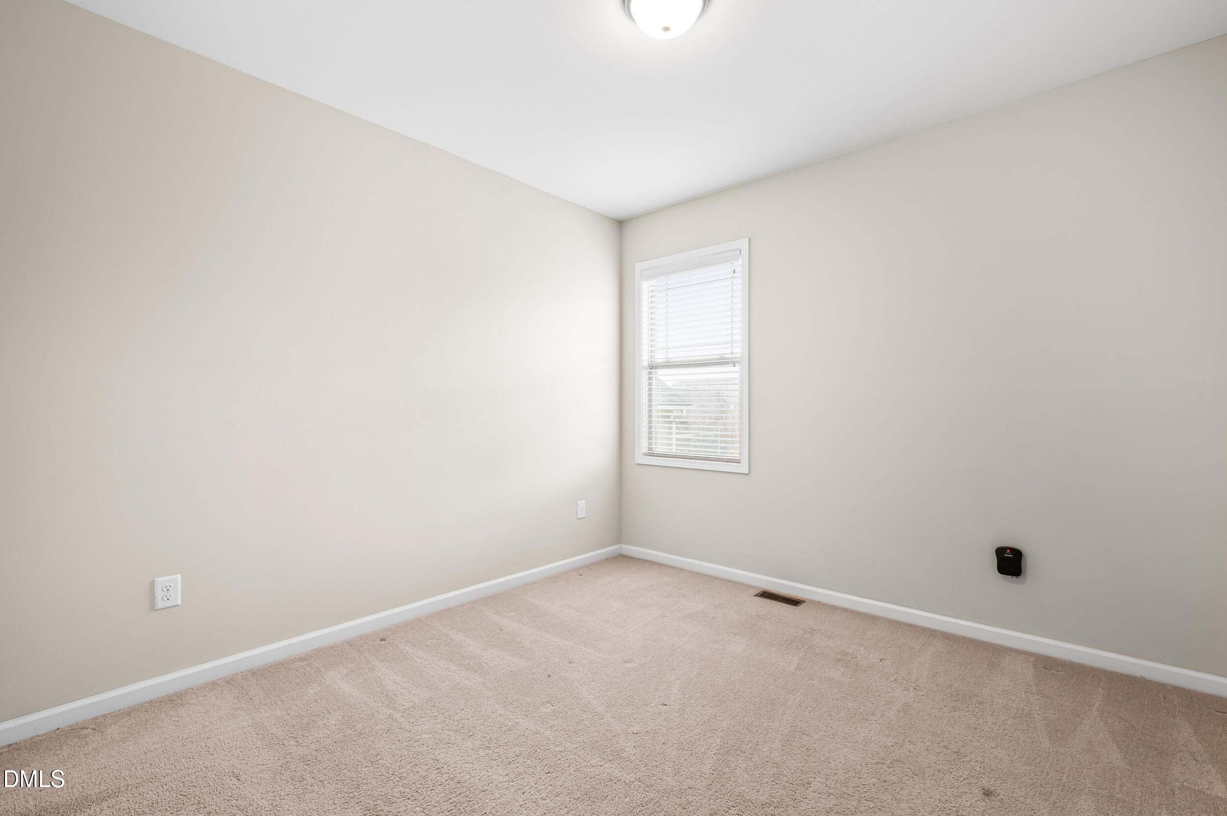1301 Oatney Ridge Lane Morrisville, NC 27560 - Photo 25 of 38 an empty room with a window