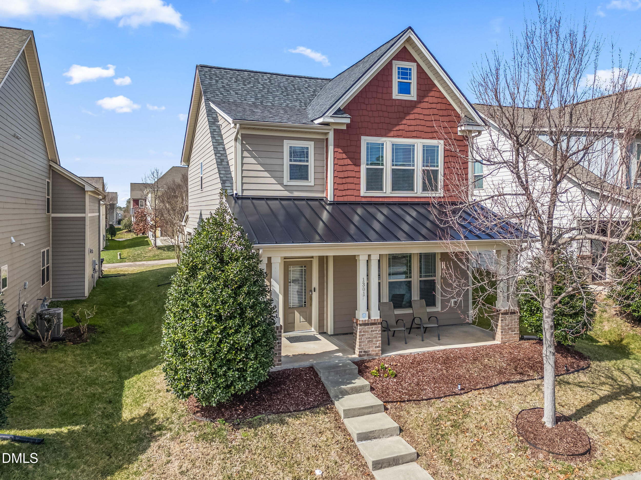 1301 Oatney Ridge Lane Morrisville, NC 27560 - Photo 2 of 38 a front view of a house with garden