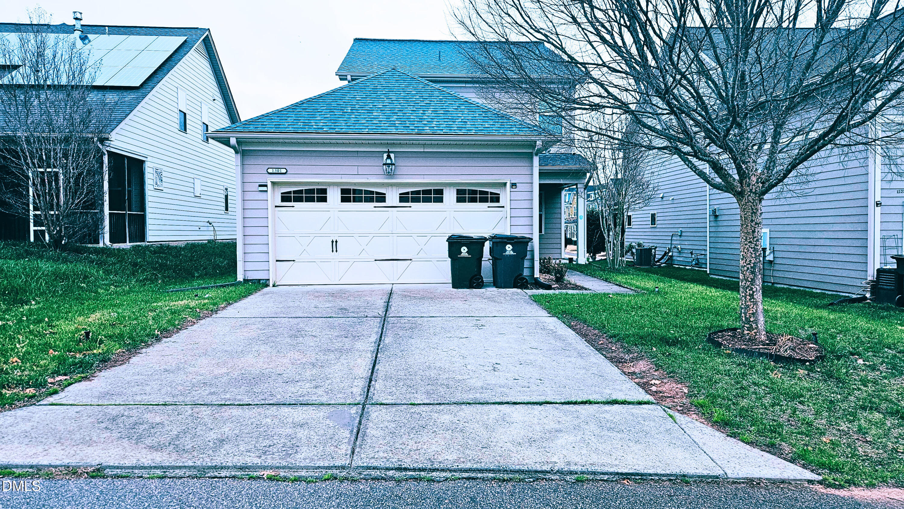 1301 Oatney Ridge Lane Morrisville, NC 27560 - Photo 35 of 38 a front view of a house with a yard and trees