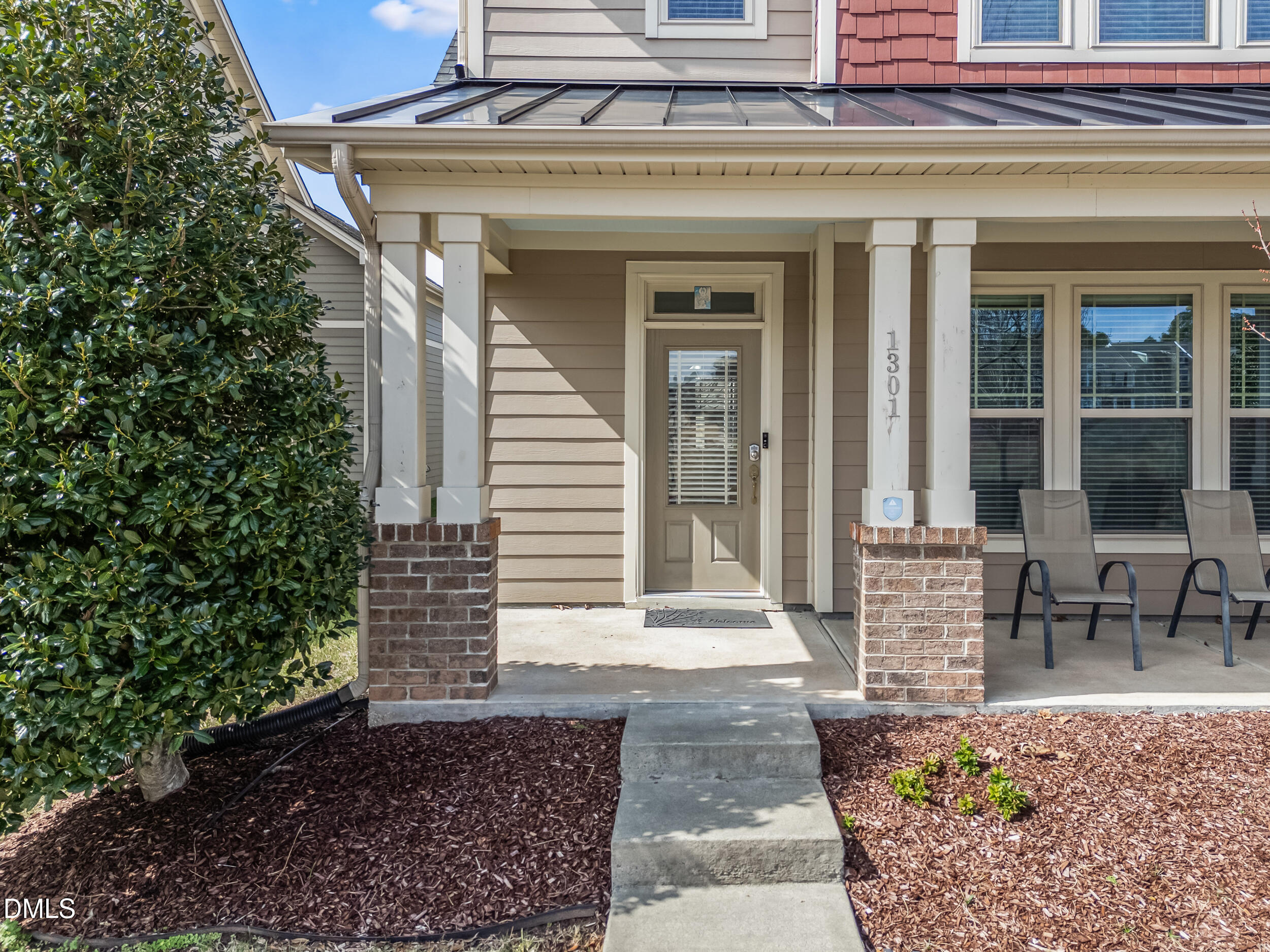 1301 Oatney Ridge Lane Morrisville, NC 27560 - Photo 3 of 38 a front view of a house with outdoor seating