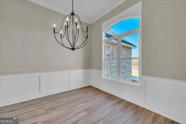 a kitchen with stainless steel appliances a stove microwave and a refrigerator