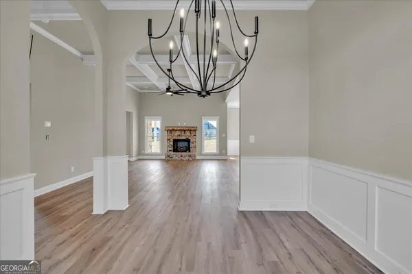 a kitchen with stainless steel appliances granite countertop a sink a stove and a refrigerator