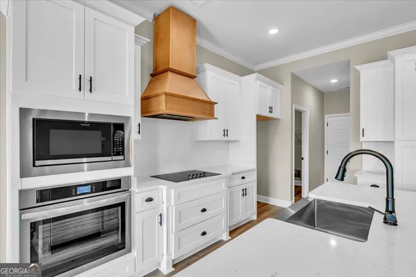 an empty room with fan and windows