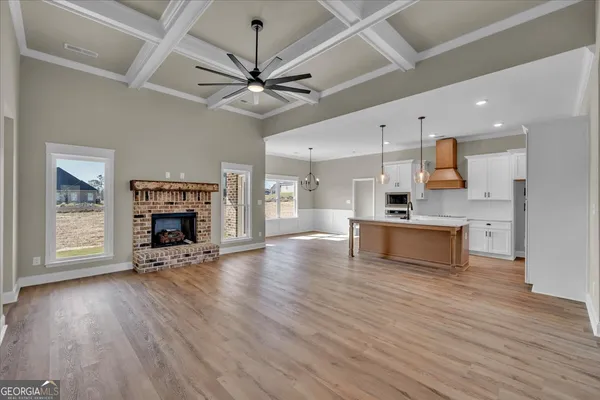 a view of room with window and ceiling fan