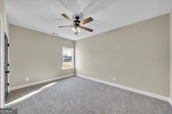 a house with trees in the background