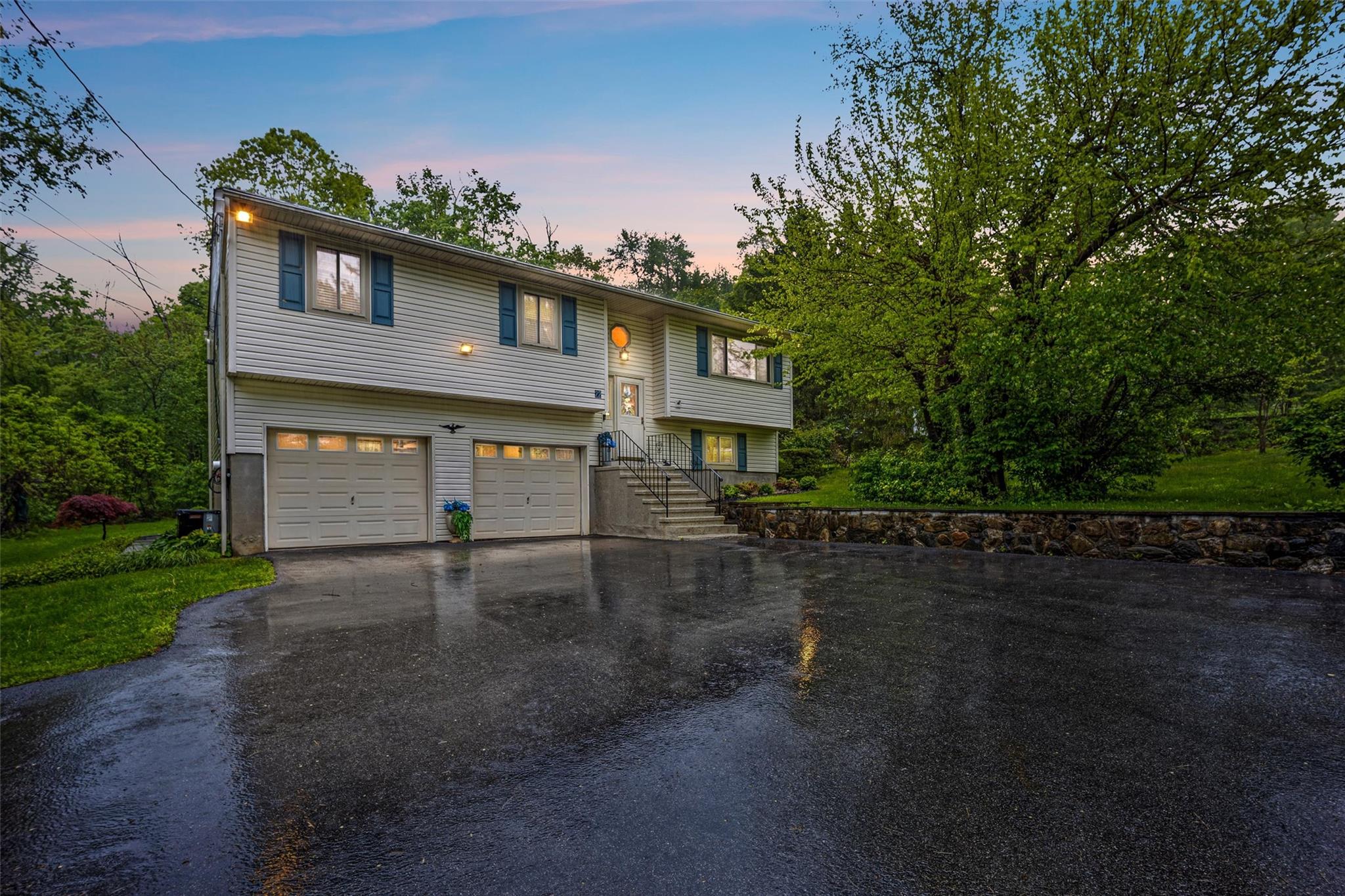 22 Muscoot Road North Mahopac, NY 10541 - Photo 1 of 1 a front view of a house with a yard and garage