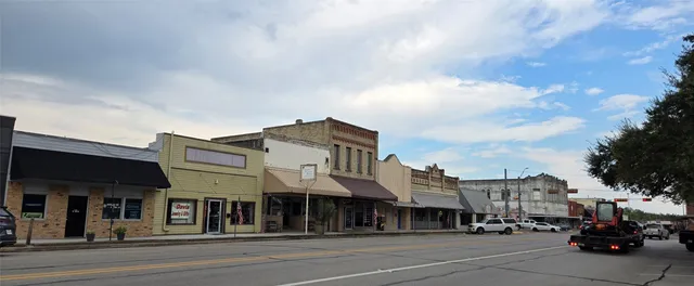 a view of a building with a street