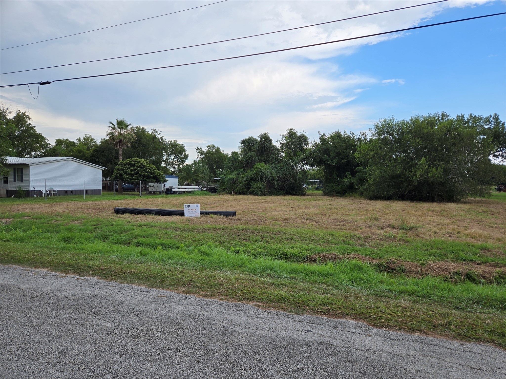0 Peabody Street Edna, TX 77957 - Photo 5 of 7 a backyard of a house with lots of green space