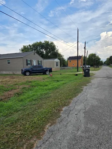 a house view with a sitting space and garden