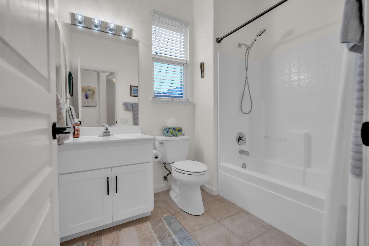 3509 Boulder Ridge Court Rocklin, CA 95765 - Photo 10 of 46 a bathroom with a sink toilet and shower
