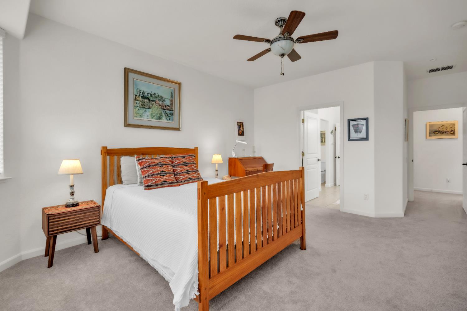 3509 Boulder Ridge Court Rocklin, CA 95765 - Photo 17 of 46 a bedroom with a bed and a chandelier fan