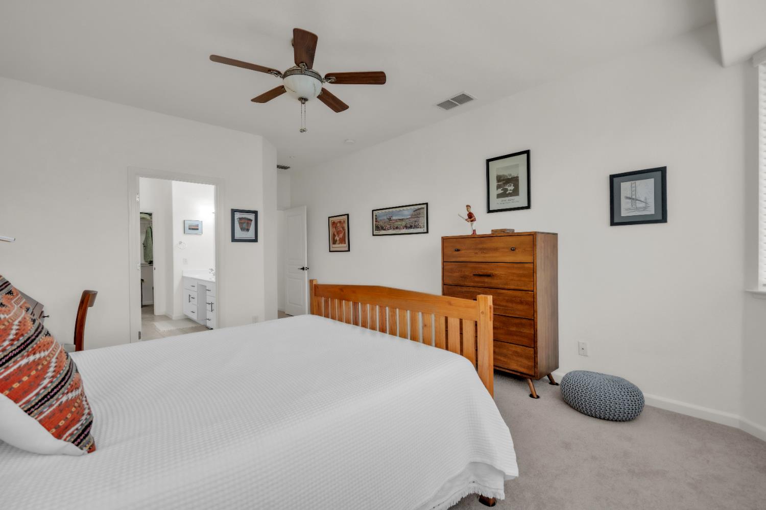 3509 Boulder Ridge Court Rocklin, CA 95765 - Photo 18 of 46 a bedroom with a bed and a chandelier