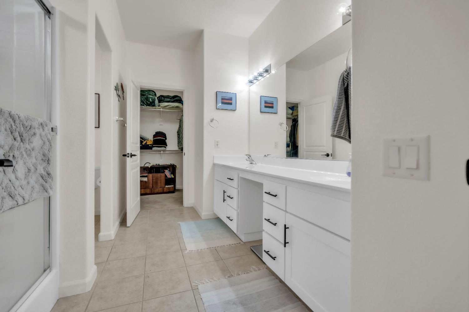 3509 Boulder Ridge Court Rocklin, CA 95765 - Photo 19 of 46 a bathroom with a double vanity sink and a mirror