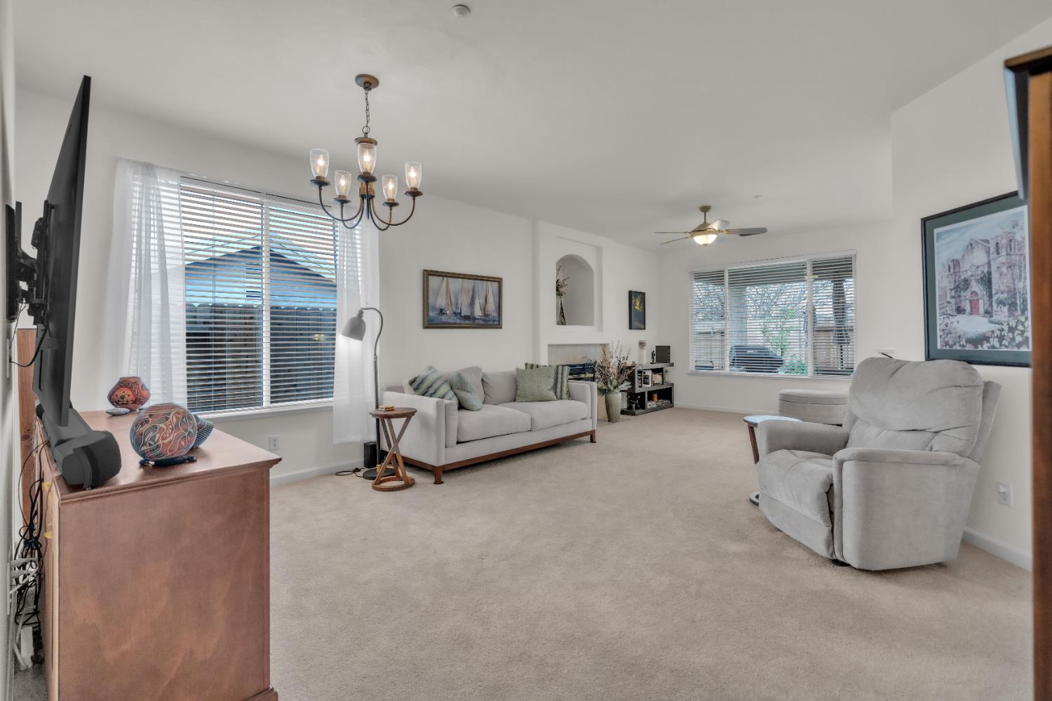 3509 Boulder Ridge Court Rocklin, CA 95765 - Photo 2 of 46 a living room with furniture and a chandelier