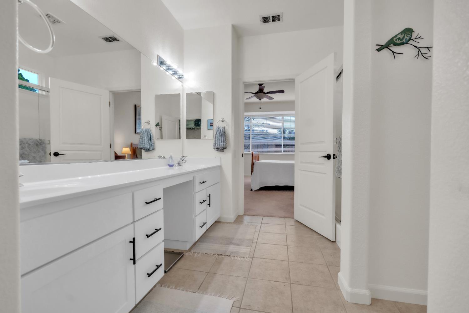 3509 Boulder Ridge Court Rocklin, CA 95765 - Photo 20 of 46 a spacious bathroom with a double vanity sink a mirror and a bathtub