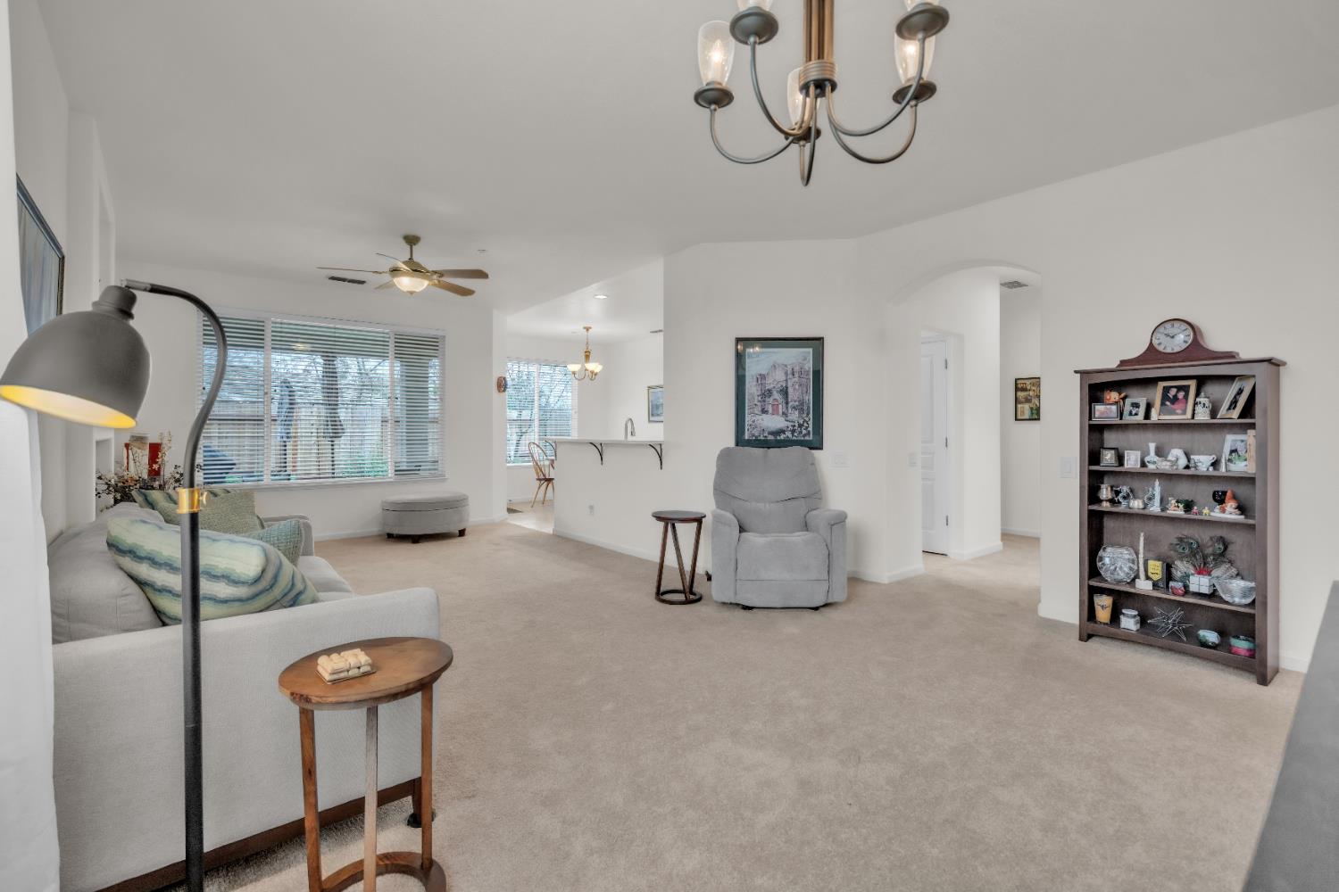 3509 Boulder Ridge Court Rocklin, CA 95765 - Photo 5 of 46 a living room with furniture and a chandelier