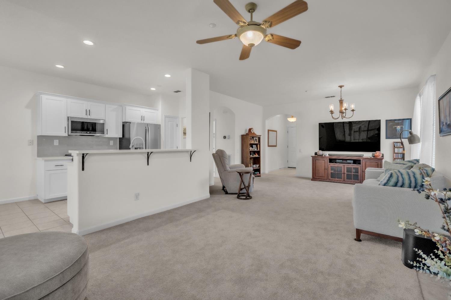 3509 Boulder Ridge Court Rocklin, CA 95765 - Photo 6 of 46 a living room with furniture and a flat screen tv