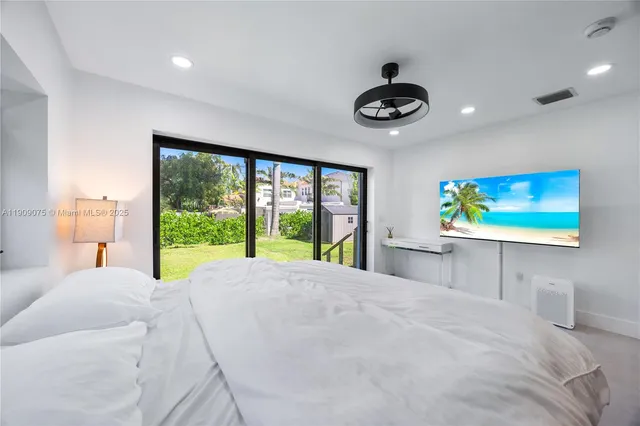 a view of a room with furniture and windows