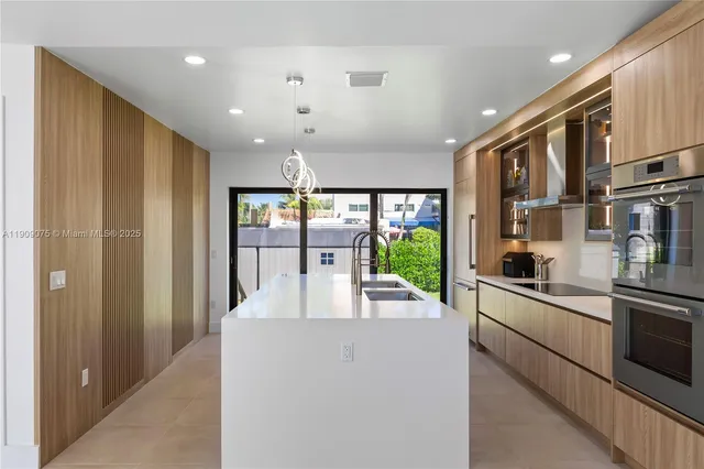 a kitchen with stainless steel appliances granite countertop lots of counter top space