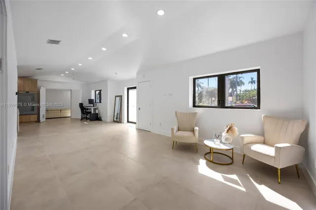 a living room with furniture and a table