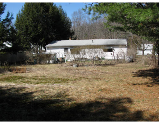 966 Ryan Road Northampton, MA 01062 - Photo 5 of 6 a view of a house with a yard
