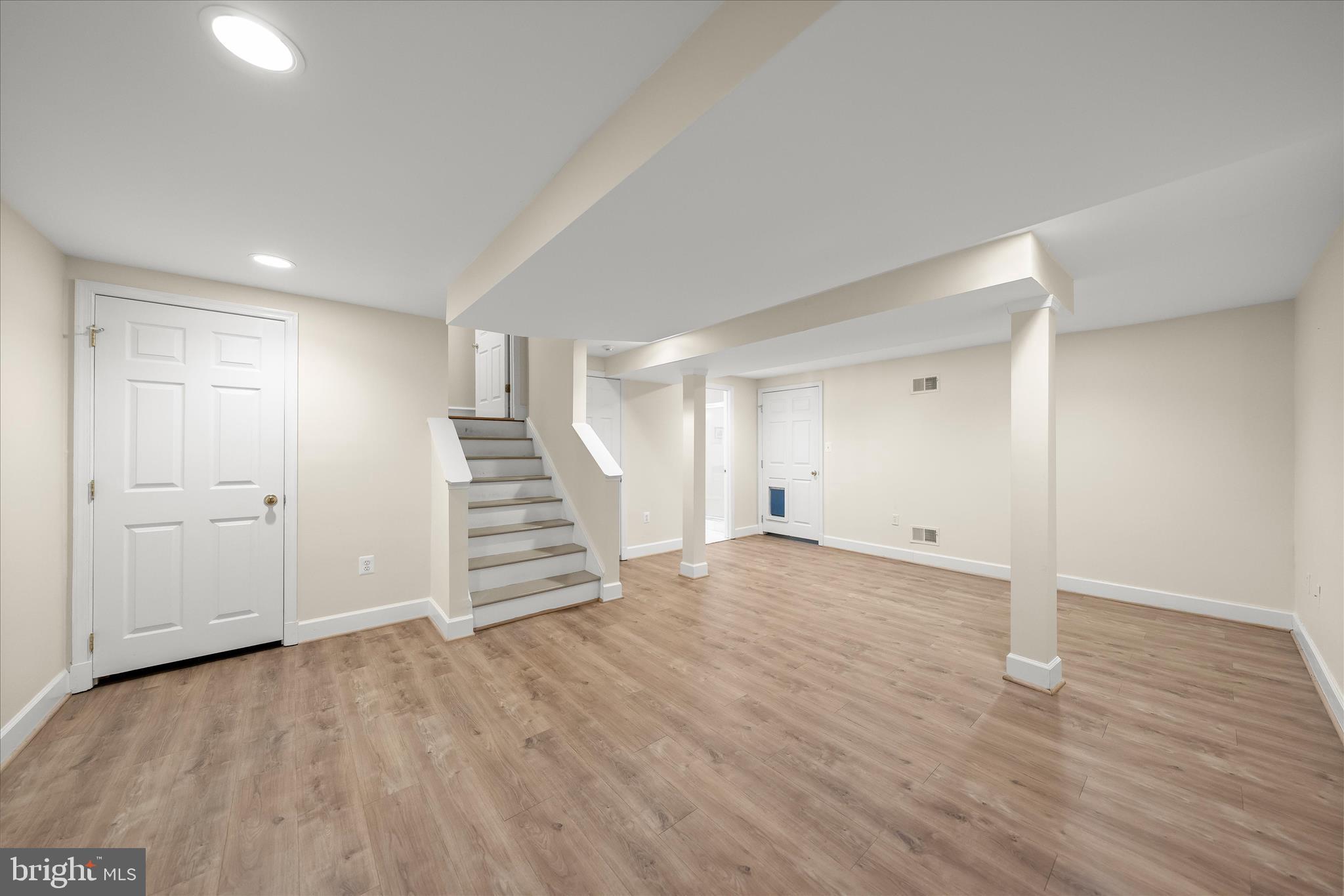 5104 Scarsdale Road Bethesda, MD 20816 - Photo 50 of 68 a view of empty room with wooden floor and entryway