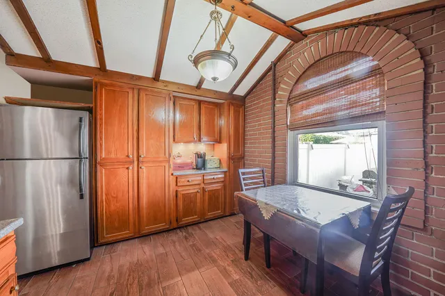 a view of a hallway with wooden floor and a hallway