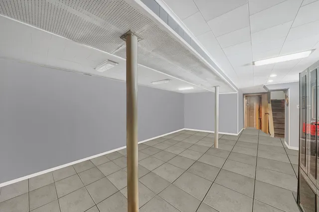 a view of a patio with a table and chairs and potted plants