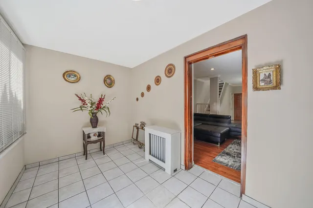 a living room with furniture flat screen tv and a table