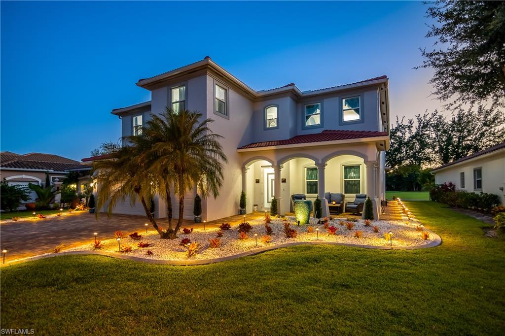 a view of a house with swimming pool patio and a yard