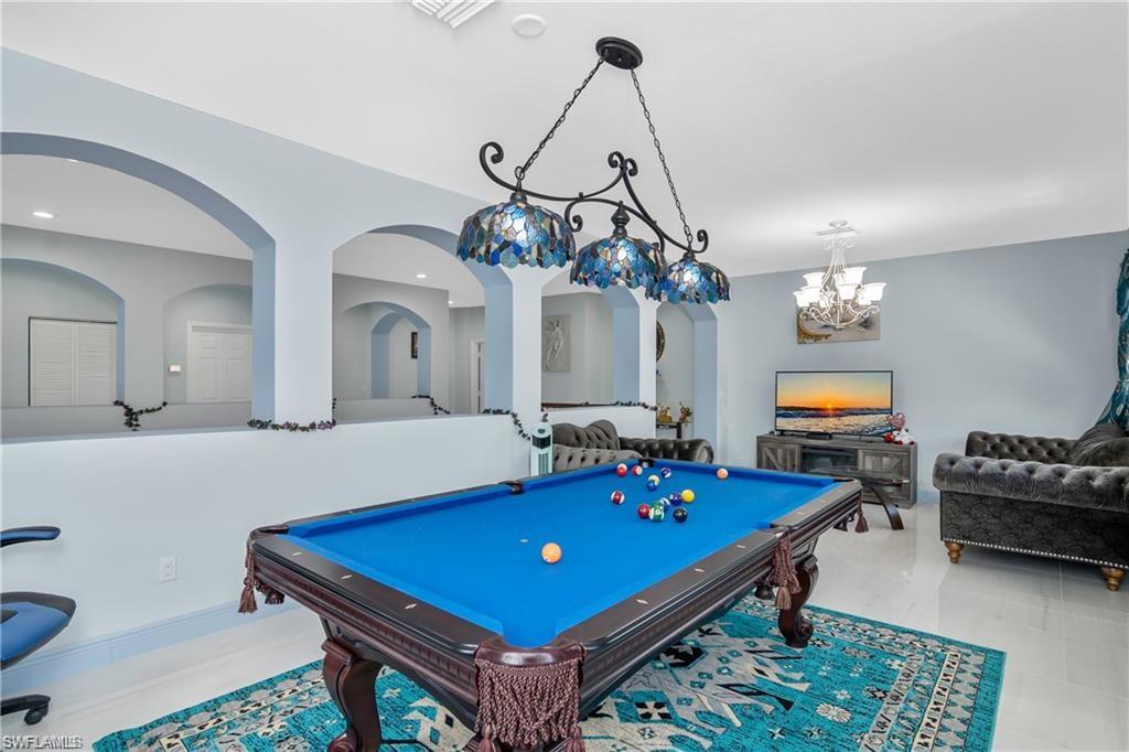 2181 Vardin Place Naples, FL 34120 - Photo 18 of 37 a room with pool table and windows