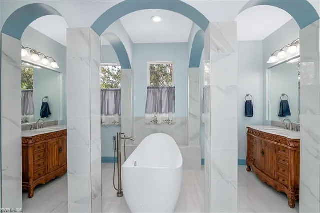 a bathroom with a sink a mirror and a shower