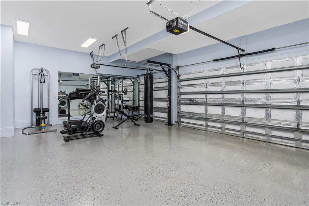 2181 Vardin Place Naples, FL 34120 - Photo 31 of 37 a view of a room with gym equipment
