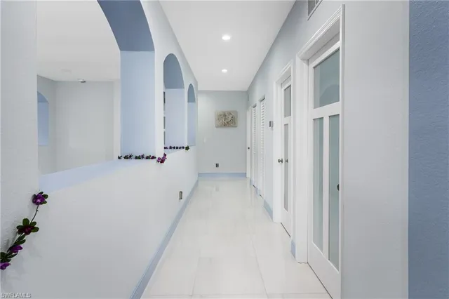 a view of a hallway with white walls
