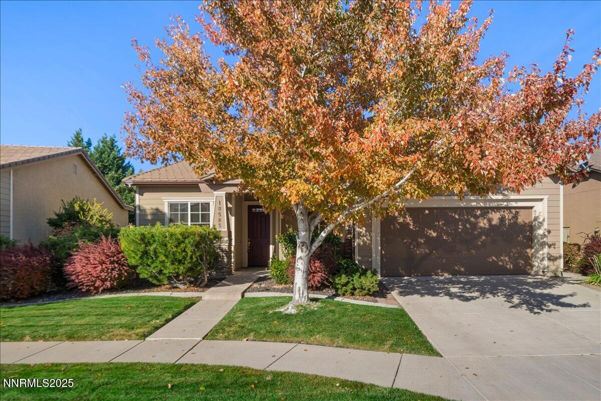 10583 Crystal Bay Drive Reno, NV 89521 - Photo 1 of 43 a front view of house with yard and green space