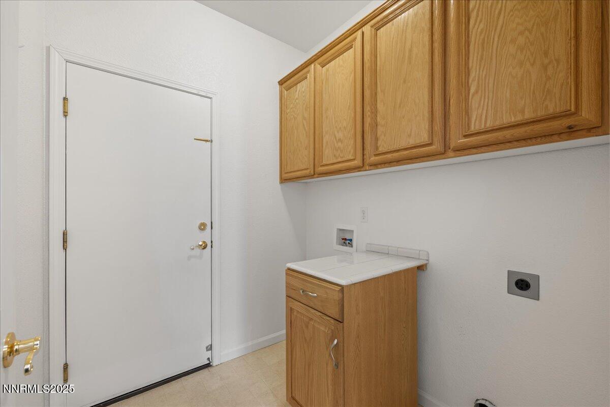 10583 Crystal Bay Drive Reno, NV 89521 - Photo 32 of 43 a utility room with dryer and washer