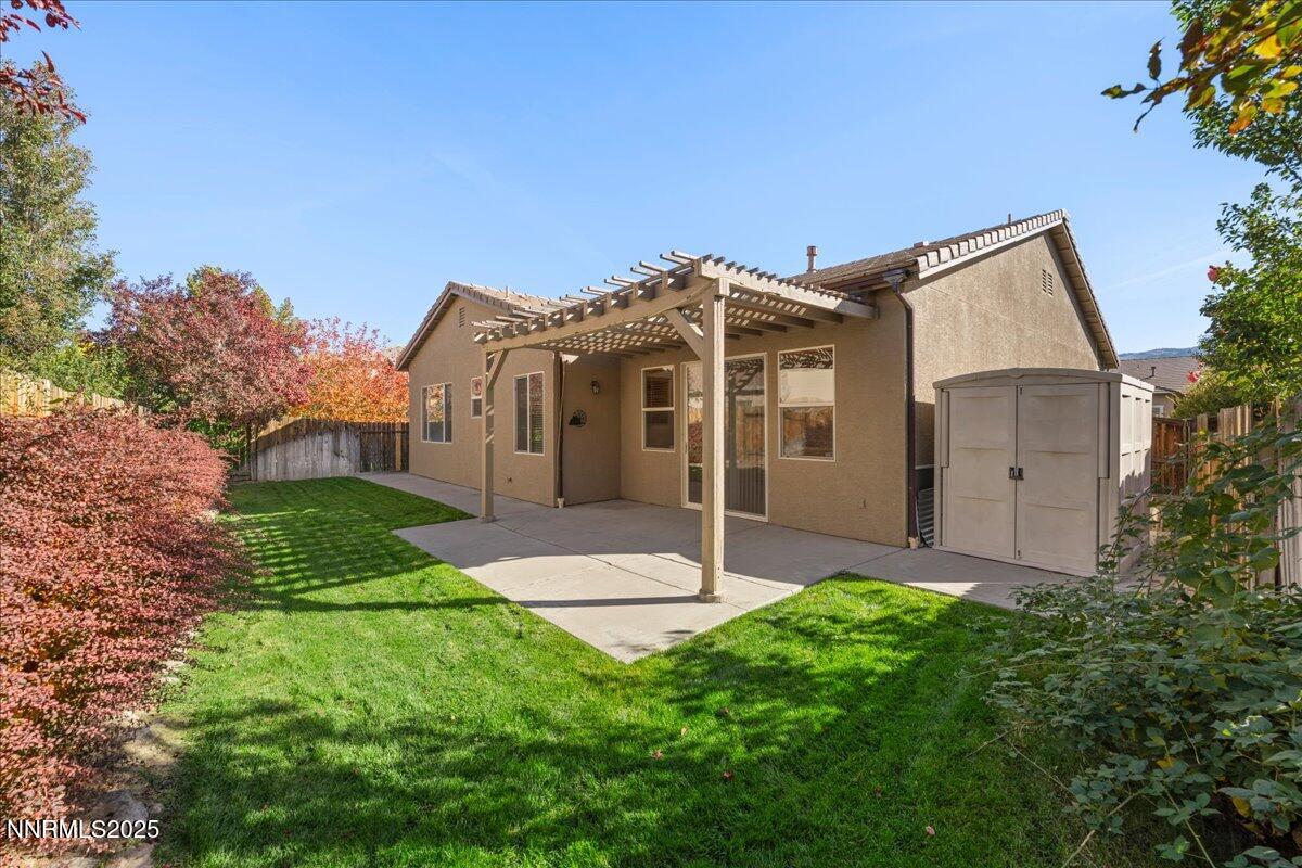 10583 Crystal Bay Drive Reno, NV 89521 - Photo 35 of 43 a front view of a house with a yard and garage