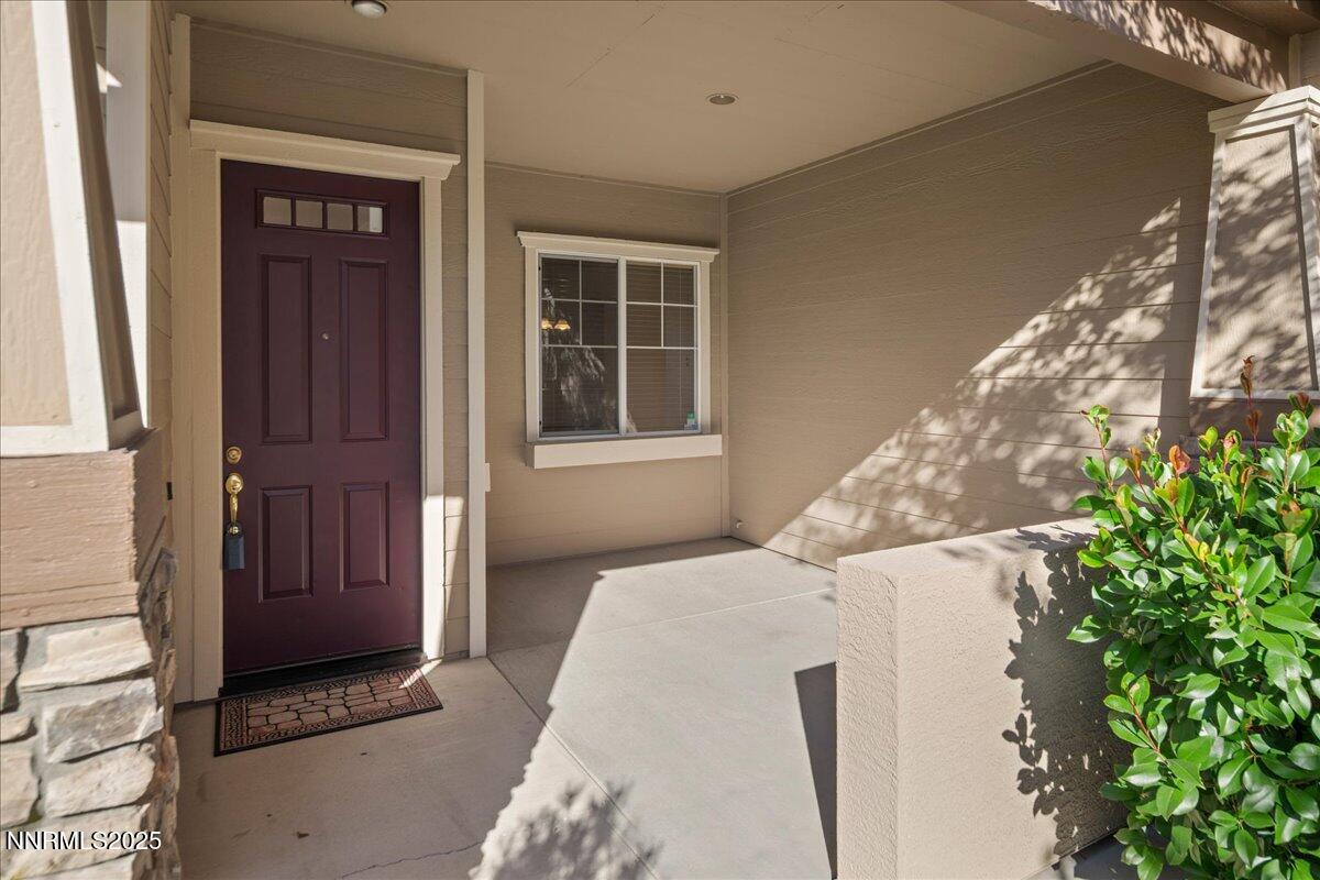 10583 Crystal Bay Drive Reno, NV 89521 - Photo 6 of 43 a bedroom with a bed and a potted plant