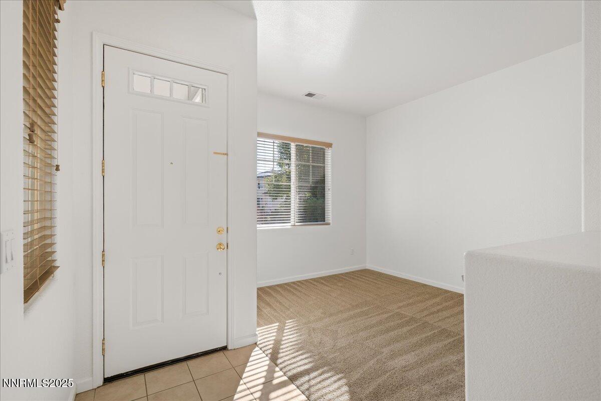 10583 Crystal Bay Drive Reno, NV 89521 - Photo 7 of 43 a bedroom with a bed and a window
