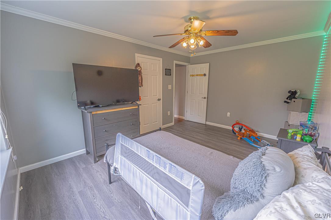 897 North Summit Road Bath, PA 18014 - Photo 13 of 35 a bedroom with a bed and a flat screen tv
