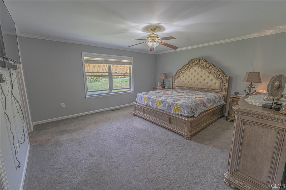 897 North Summit Road Bath, PA 18014 - Photo 22 of 35 a spacious bedroom with a bed and window