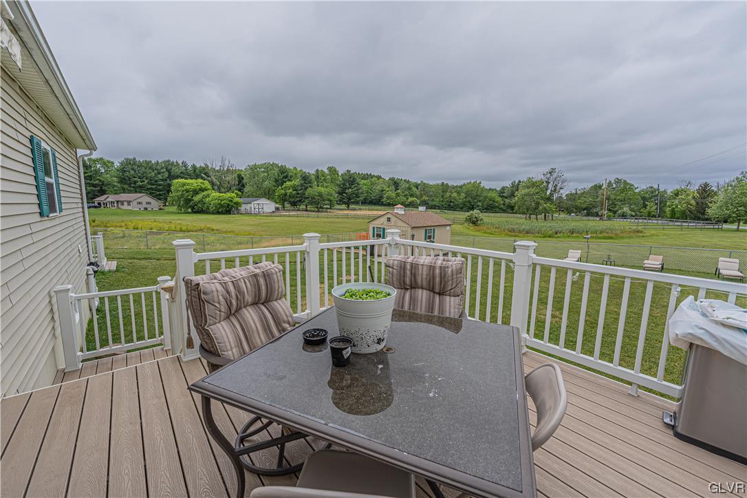 897 North Summit Road Bath, PA 18014 - Photo 25 of 35 a view of a deck with couches wooden floor and lake view
