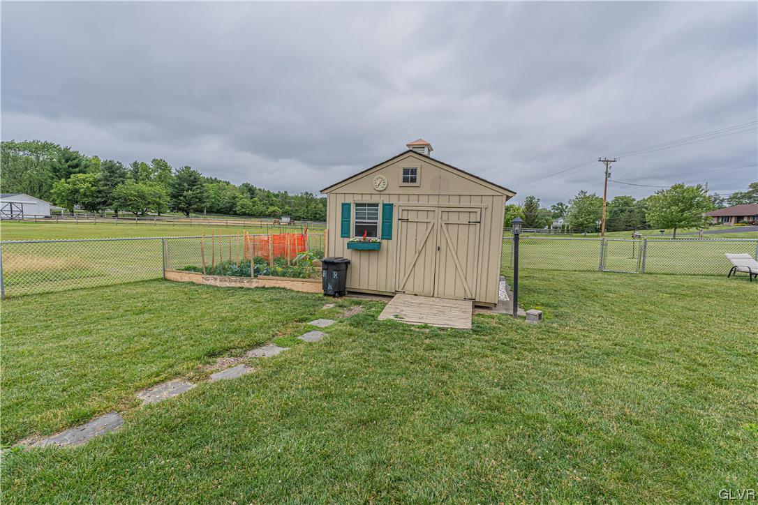 897 North Summit Road Bath, PA 18014 - Photo 28 of 35 a view of a house with a yard and a garden