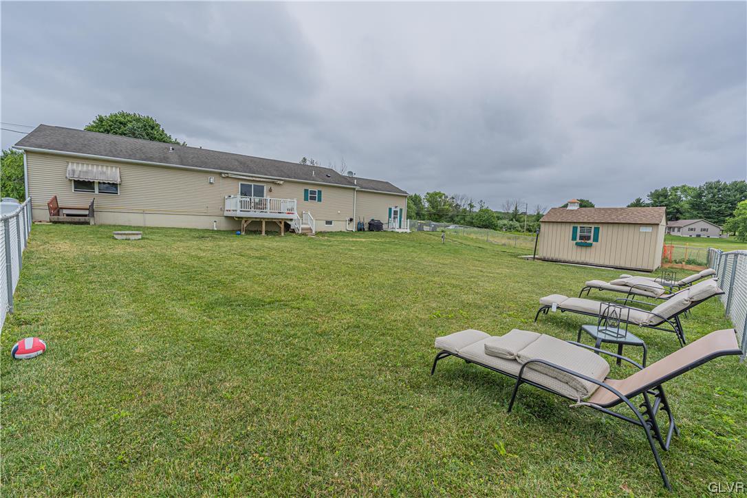 897 North Summit Road Bath, PA 18014 - Photo 30 of 35 a backyard of a house with table and chairs