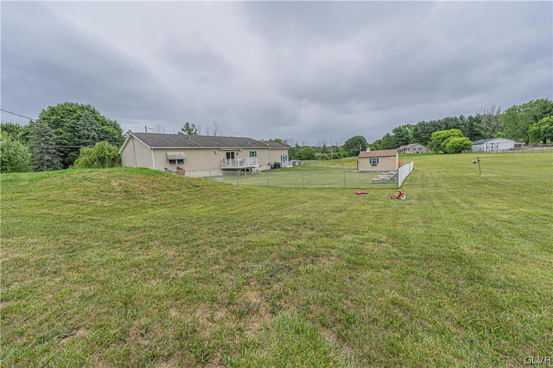 897 North Summit Road Bath, PA 18014 - Photo 32 of 35 a view of a big yard with an buildings and a big yard
