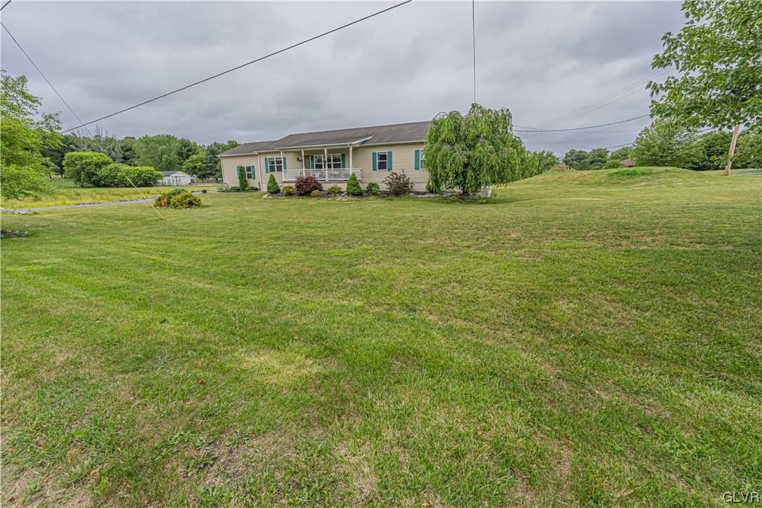 897 North Summit Road Bath, PA 18014 - Photo 34 of 35 a big yard with plants and large trees