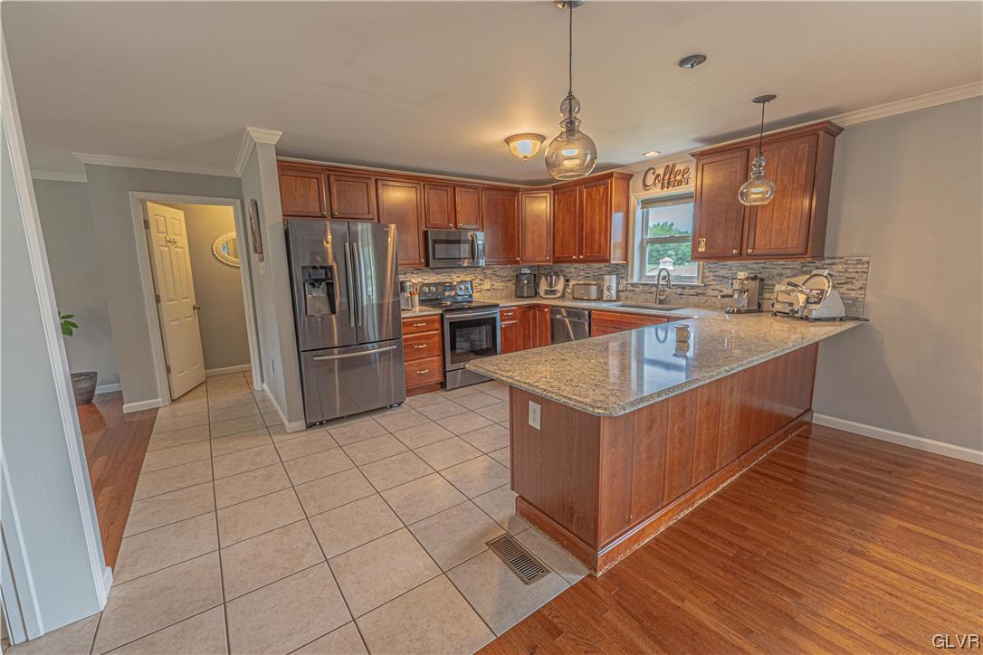 897 North Summit Road Bath, PA 18014 - Photo 8 of 35 a kitchen with stainless steel appliances granite countertop a refrigerator and a stove