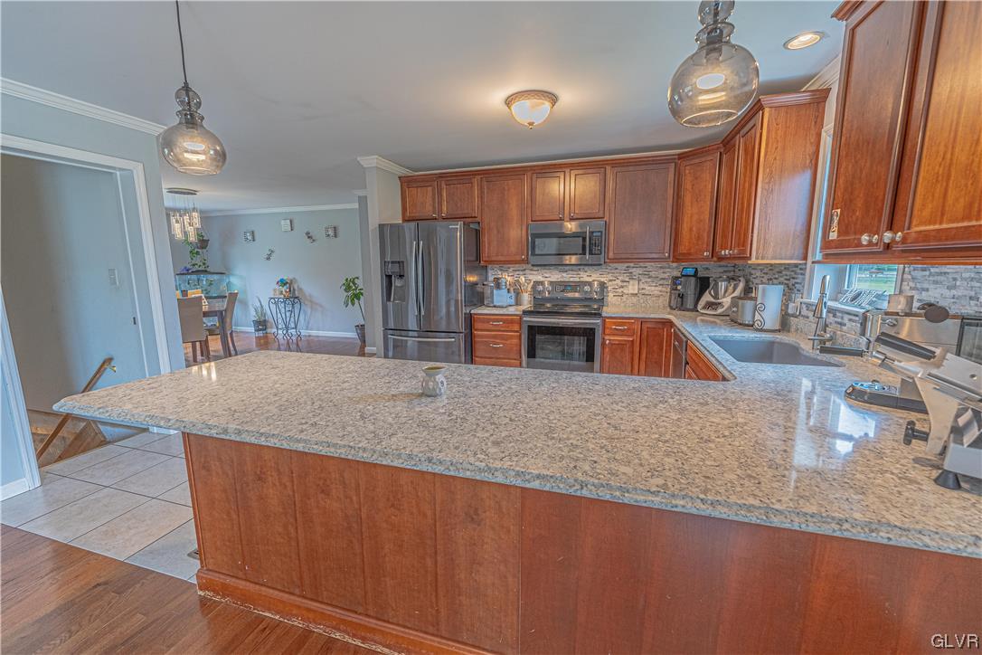 897 North Summit Road Bath, PA 18014 - Photo 9 of 35 a kitchen with stainless steel appliances granite countertop a sink a stove counter space and cabinets