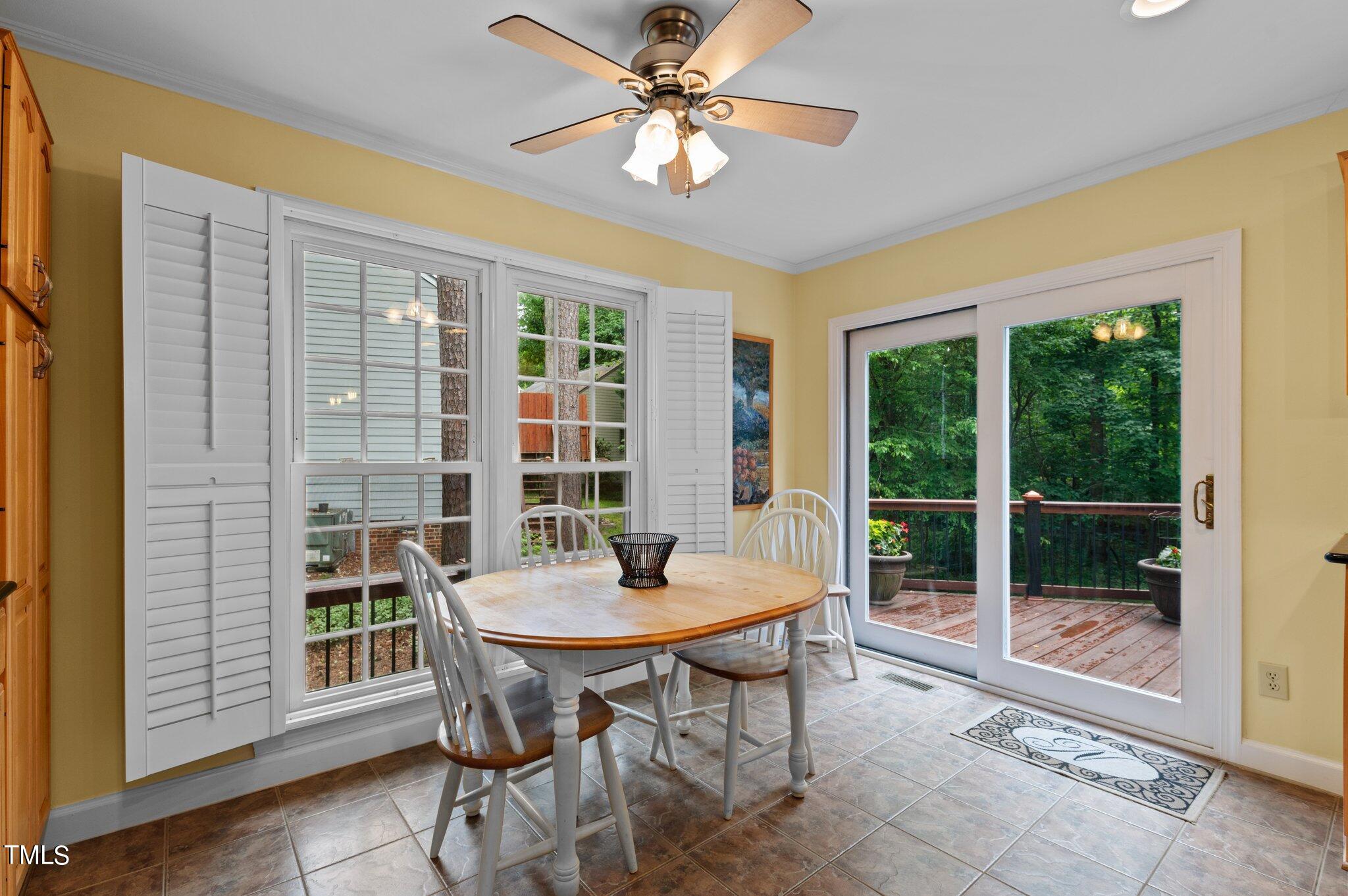 8116 Coleraine Court Raleigh, NC 27615 - Photo 12 of 58 a view of a dining room with furniture window and wooden floor